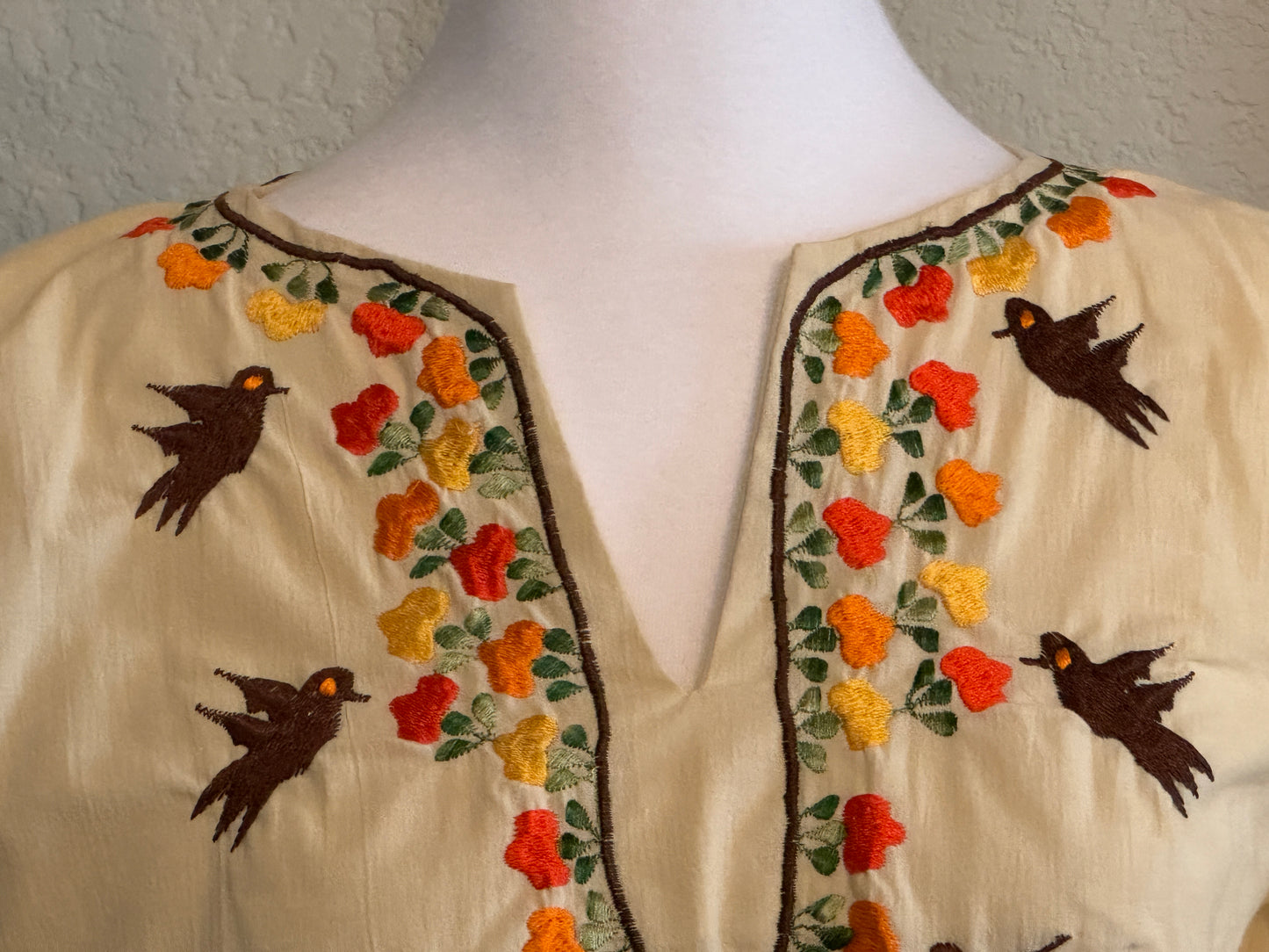 Men Lor  Creme Three Quater Length Blouse With Embroidered Birds Accent