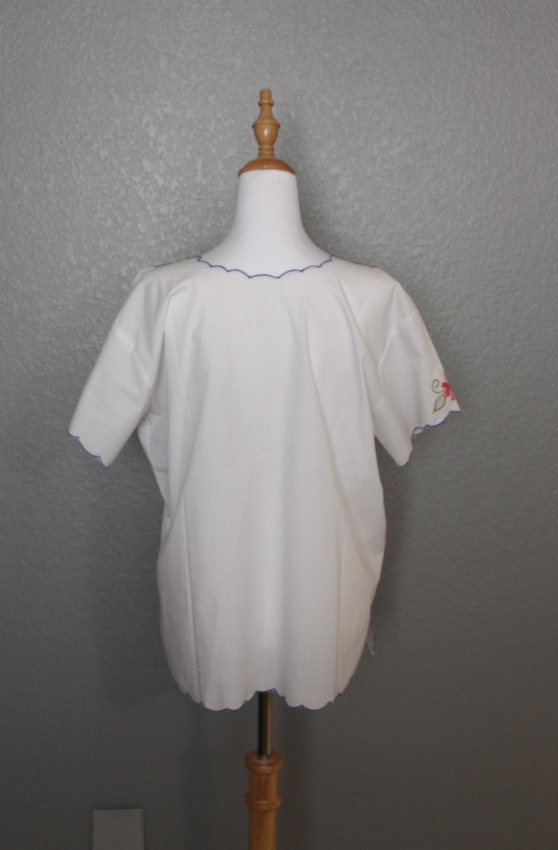 White Mexican Embroidered / Stitched Short Sleeve Shirt with scoop pattern with flowers.