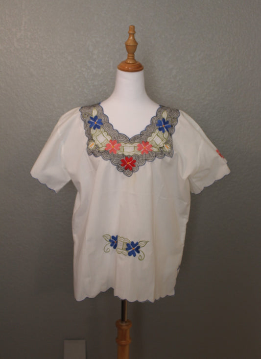 White Mexican Embroidered / Stitched Short Sleeve Shirt with scoop pattern with flowers.